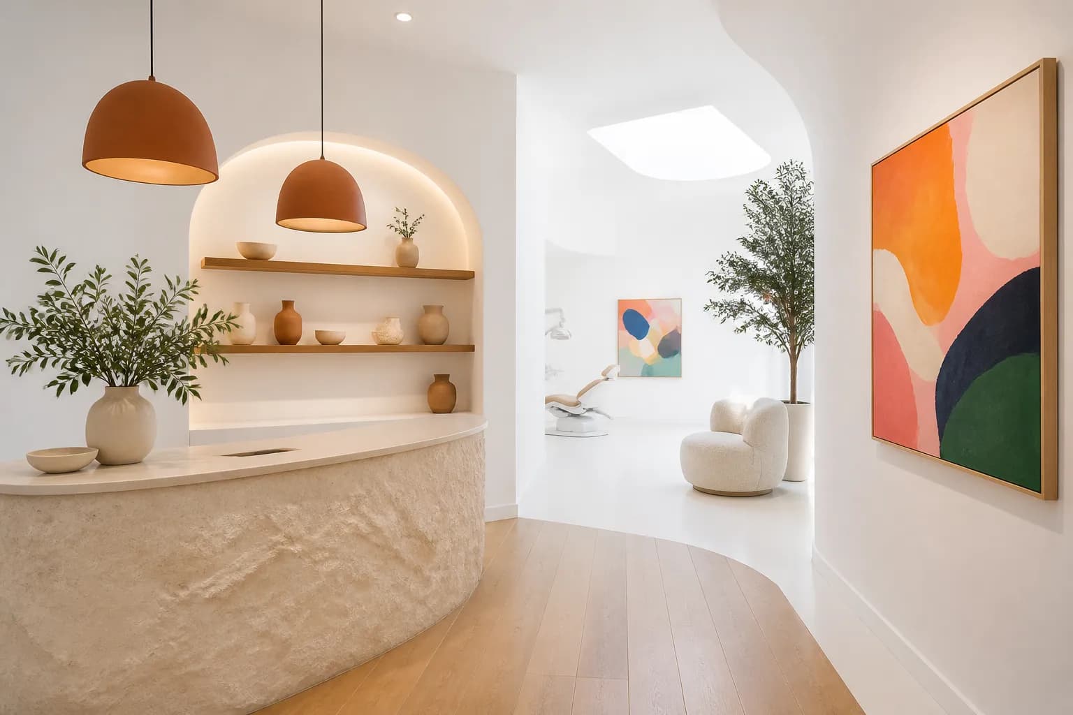 The reception counter in pale stone, with terracotta pendant lamps above it.